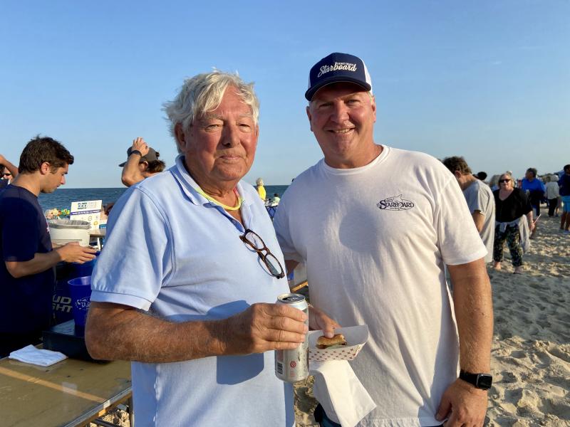 Resident Phil Winkler, left, chats with Dewey Business Partnership President and The Starboard owner Steve “Monty” Montgomery. ELLEN DRISCOLL PHOTO