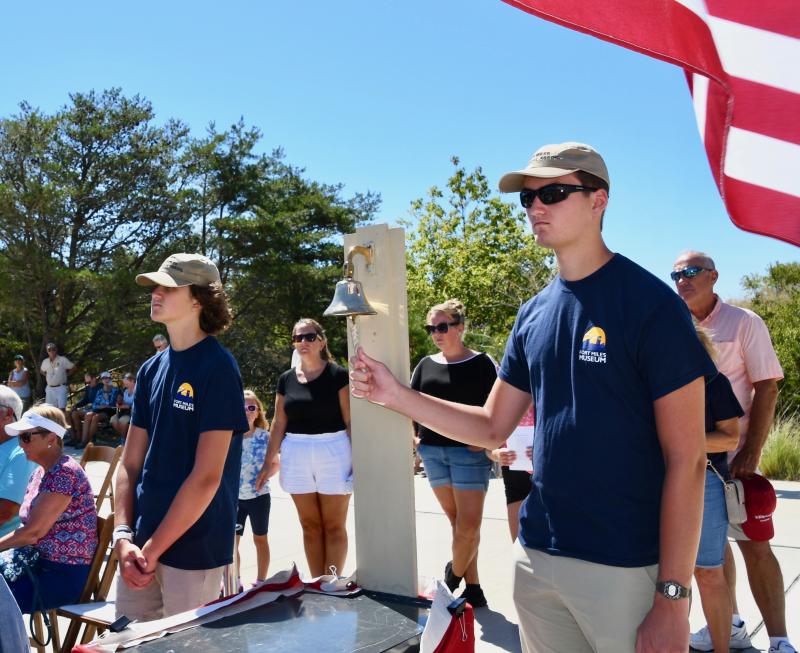 Nicholas Schimmel, right, and his brother Christian take turns ringing the ship’s bell in memory of Delawareans who were killed during World War II. The brothers are grandchildren of the late Gary Wray, the first FMHA president, who served for 17 years.