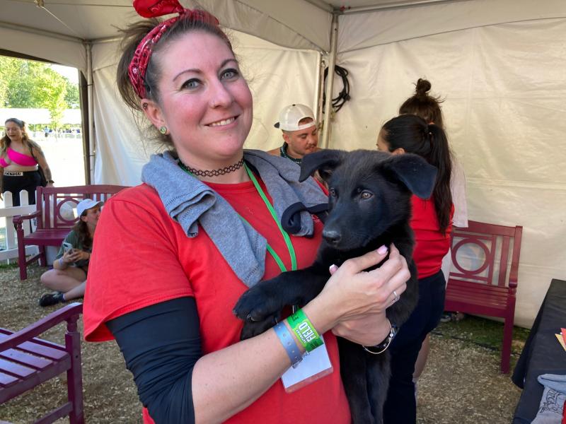 The Firefly grounds was not just a place for music, but also for a chance to do good deeds at the Good Hub. The star attraction at the Good Hub was Brandywine Valley SPCA’s dog adoption center, where volunteer Meghan Weigert holds Amani, a two-and-a-half month old black lab. The Good Hub also featured tents with organizations such as Planned Parenthood, CAMP Rehoboth and Code Purple. RYAN MAVITY PHOTO