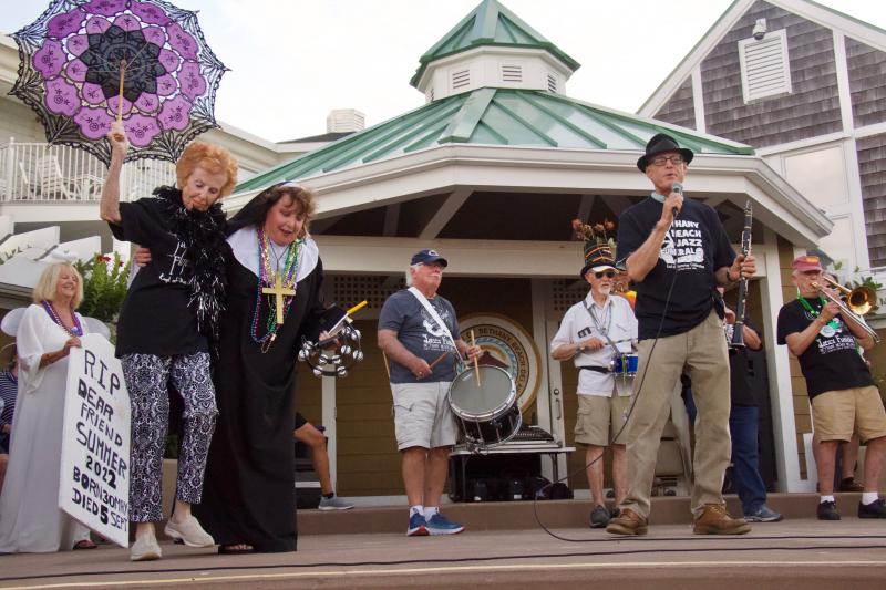 Jazz Funeral Co-Chair Angel Carolyn Bacon, super soul Marilyn Panagopoulos, and Sister Marie Wright dance to the music created by drummer Ron Lewis, band leader John Strawley and the rest of the jazz funeral band.