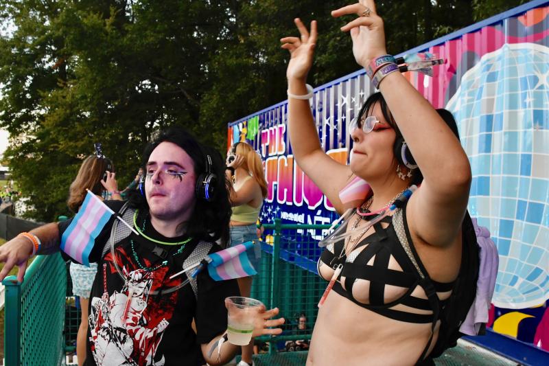 A couple dances on the porch of The Thicket where festival-goers can wear headsets and dance to the music. RON MACARTHUR PHOTO