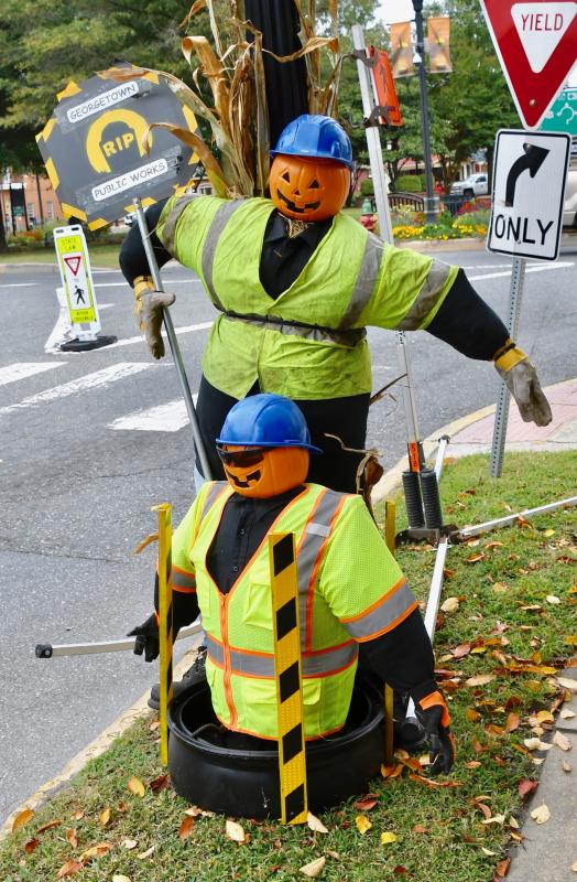 The Georgetown Public Works Department has a pair of working scarecrows on display at the corner of The Circle and South Bedford Street.