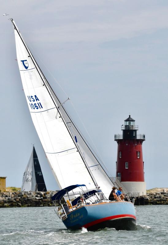 Iris leans into the wind as it nears the Delaware Breakwater East End Lighthouse, the turnaround point in the keel boat race.