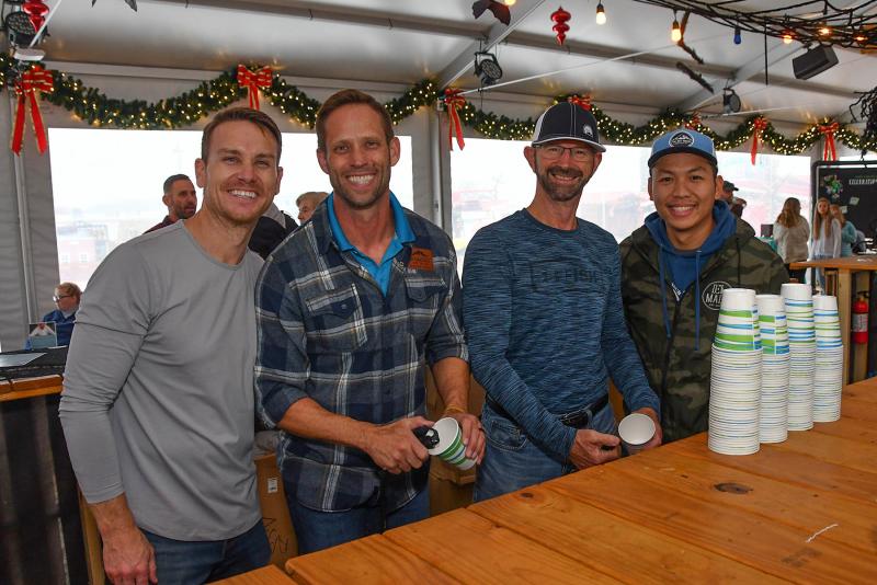 Bartenders at the event are (l-r) Tyler Brock, Dan Matta, Rob Alexander and Leon Lo. Refreshments and the location were donated by the Schell Brothers.