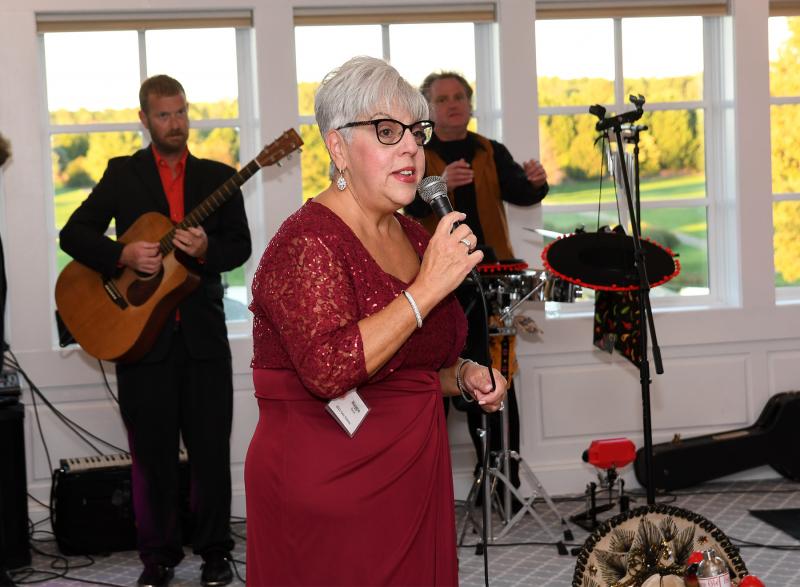 Overfalls Foundation Secretary Maggie Bauer welcomes attendees to Rock the Boat.