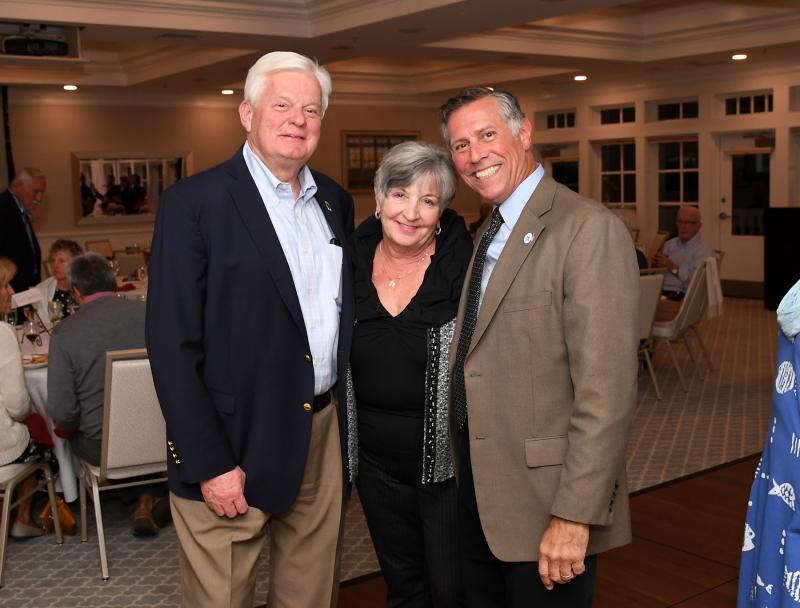 Linda Robinson, center, is flanked by former Lewes Mayor Ted Becker, left, and Rep. Steve Smyk, R-Milton.