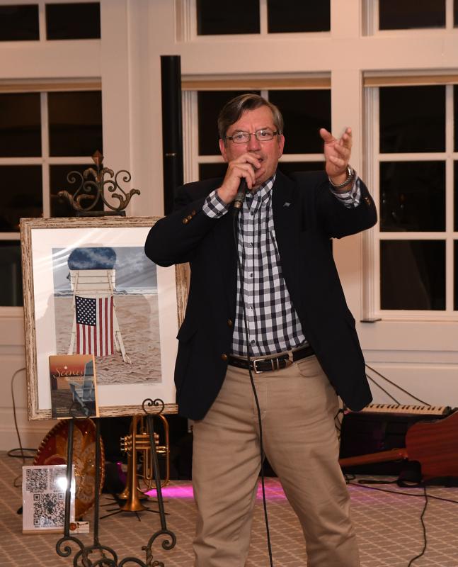Richard Bryan auctions off the print by Howard Eberle.