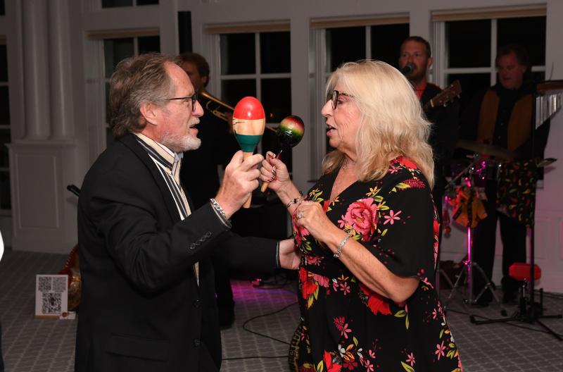 Dennis Sullivan, left, and his wife Stacy dance to the music of the Hot Sauce Band.