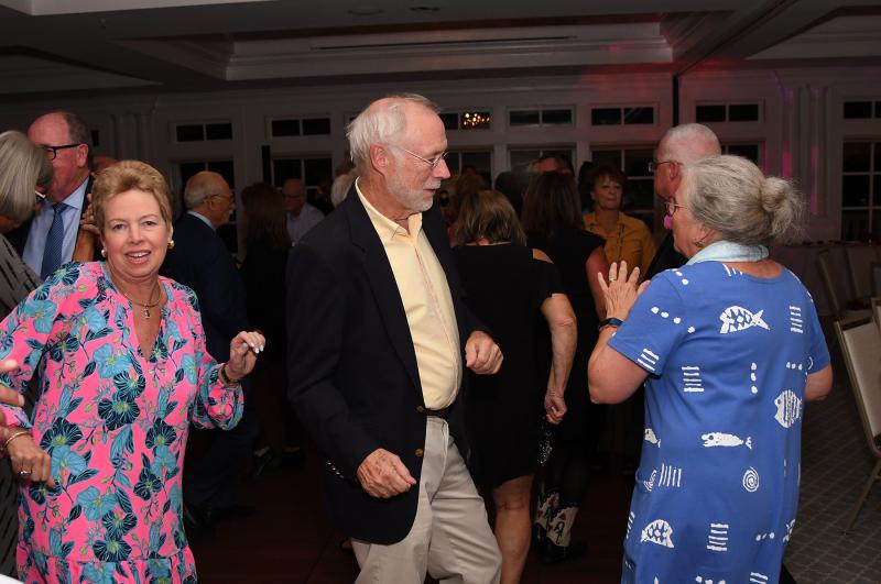 Dancing the evening away to the Hot Sauce Band are (l-r) Alice Hoens, Board Director of Volunteers John Bolster and his wife Kathy. DAN COOK PHOTOS