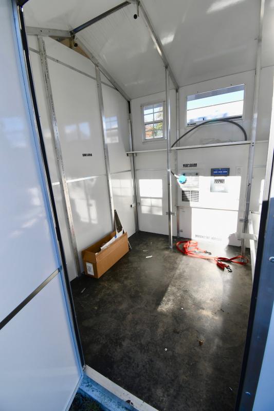 The interiors of the 64-square-foot units include heating, air conditioning, a fire extinguisher and smoke detector, lighting and electric outlets, and space for two cots and storage.