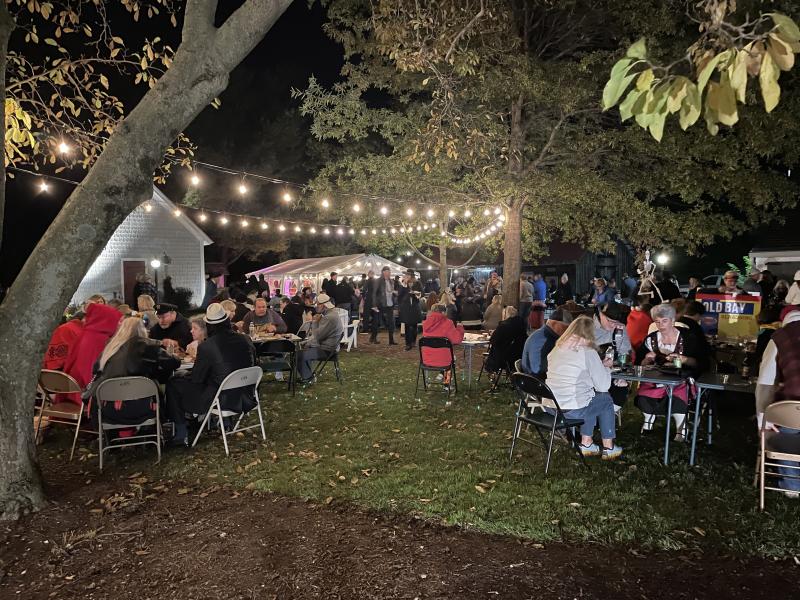 A large crowd gathers at the Lewes Historical Society complex in downtown Lewes to eat and drink at Boos & Brews.