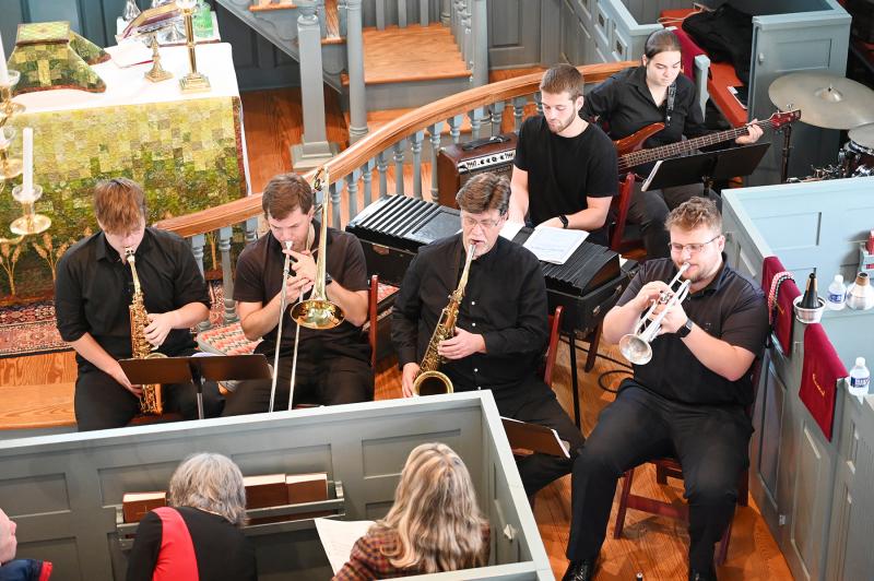 The Moravian Jazz Ensemble performs in the historic St. George’s Chapel in Harbeson during the annual jazz mass. Shown are (l-r) Coby Gumulak on alto sax, Mitchell Hourt on trombone, Dr. Neil Wetzel on tenor sax and Spencer Guido on trumpet. Behind them are Christian Beebe on piano and Grace Young on bass guitar. NICK ROTH PHOTOS