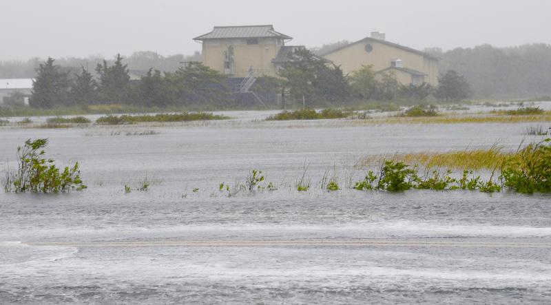 The marsh along Savannah Road in Lewes overflows onto the road Oct. 2 during the first of several predicted higher-than-normal high tides over the next two days. RON MACARTHUR PHOTO