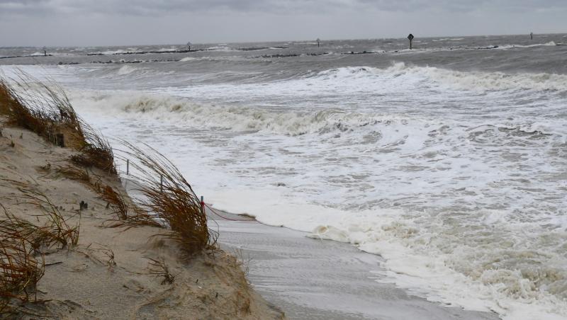 As high tide Oct. 3 approaches, unrelenting waves pound into the dune along Lewes Beach near Roosevelt Inlet. Widespread beach erosion is occurring all along the Cape Region coast. RON MACARTHUR PHOTO