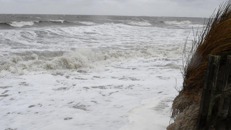 During Monday’s high tide, waves break up to the dune line along sections of Lewes Beach. RON MACARTHUR PHOTO