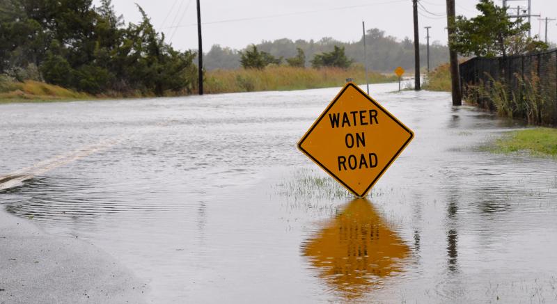 The northwest end of Pilottown Road in Lewes is closed as waters from Canary Creek flow into Delaware Bay. RON MACARTHUR PHOTO