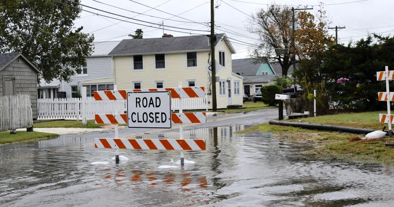 This sign is not unfamiliar to residents who experience frequent flooding in Oak Orchard. RON MACARTHUR PHOTO