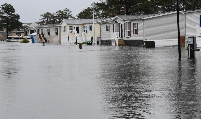 Many of the streets in Mariner’s Cove off Long Neck Road are flooded at high tide on Monday with waters from Rehoboth Bay. RON MACARTHUR PHOTO