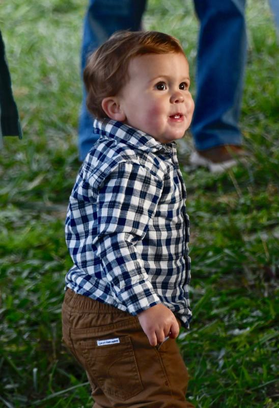 Cameron Funkhouser, who lives across the street with his parents in the Villages of Red Mill Pond, dances to the beats of down-home bluegrass music.