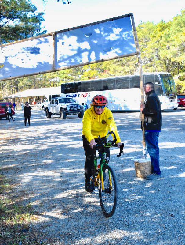 As she crosses the finish line in Cape Henlopen State Park, at 67, she becomes the oldest woman to make a cross-country bike ride.