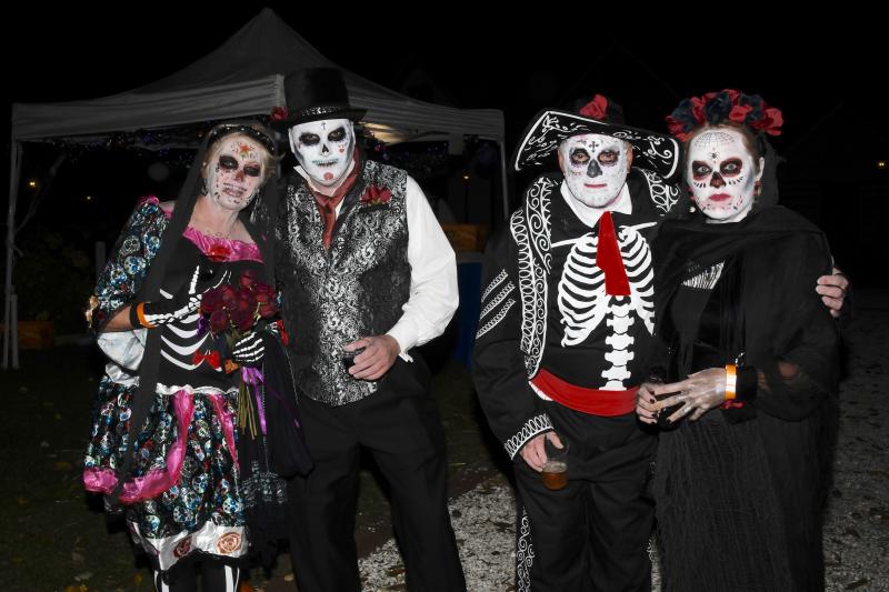Janet and Jimmy Hagan, left, and Robert Tomko and Nancy LaMotte of Fenwick Island are celebrating the season dressed as Day of the Dead revelers.