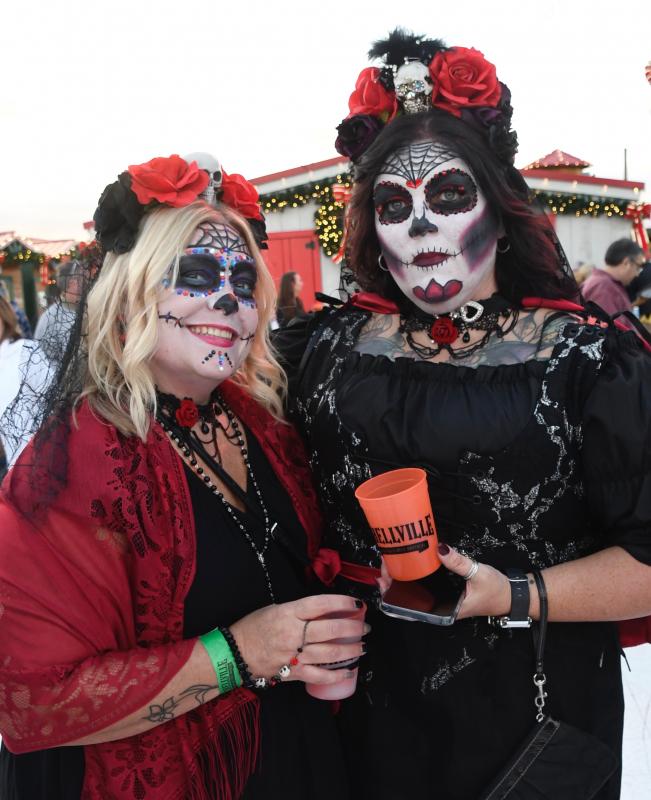Dressed up in sugar skull costumes are Jen Daniels, left, and Jamie Harris, who are visiting from Maryland.