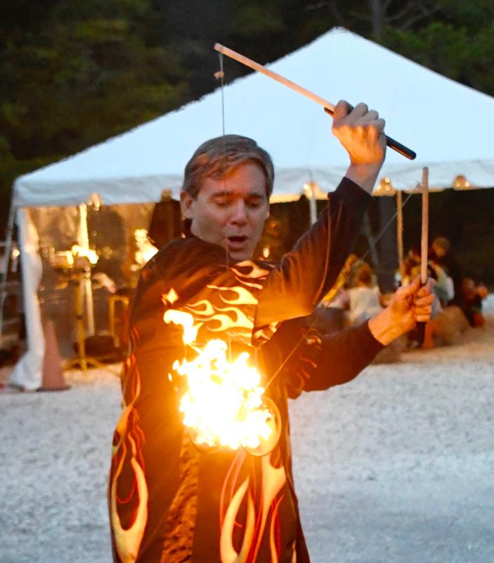 Guinness world record holder juggler Carlos Mir of Delmar delights the crowd with his feats of fire.