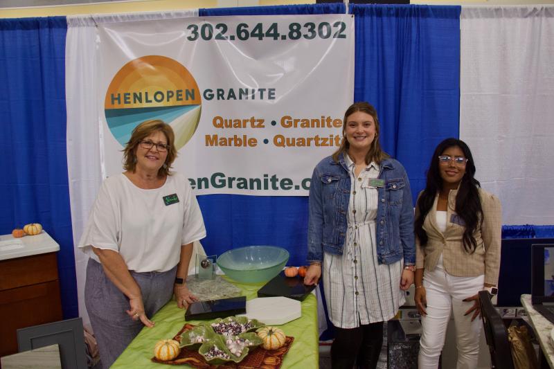 Family-owned and operated Henlopen Granite rocked new designs and fall colors. Shown are (l-r) owner Jennifer Chojnowski, Anna Chojnowski, and Darlyn Gonzalez