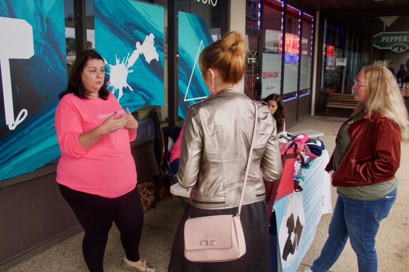 Reinie Thompson, left, discusses the foster process with Ashly Love and Amanda Kaye. Grass Roots Rescue is in need of foster homes for the dogs it receives, and while fostering can be rewarding for all, it takes some discipline to not fall in love with the animals for keeps.