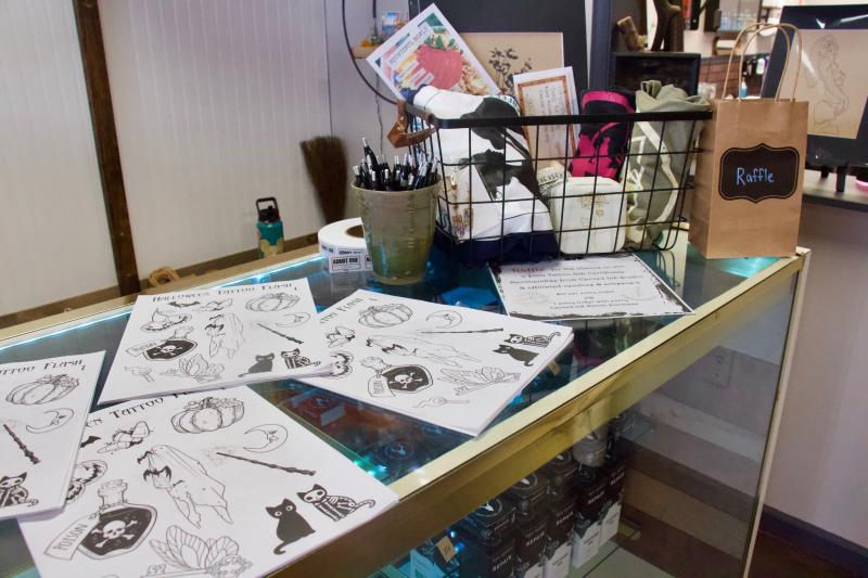 Carved Ink Studios offered a selection of Halloween- and animal-themed tattoos for $100 and held a raffle to raise funds for Grass Roots Rescue.
