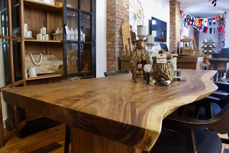 Most of the furniture in the store has been made by Old Wood Delaware such as this dining room table and curio cabinet on display.
