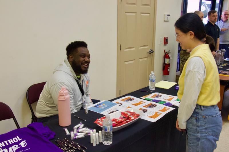 Career TEAM Delaware’s Denzell Bledsoe speaks with Sherly Zhu during the job fair period of the event.