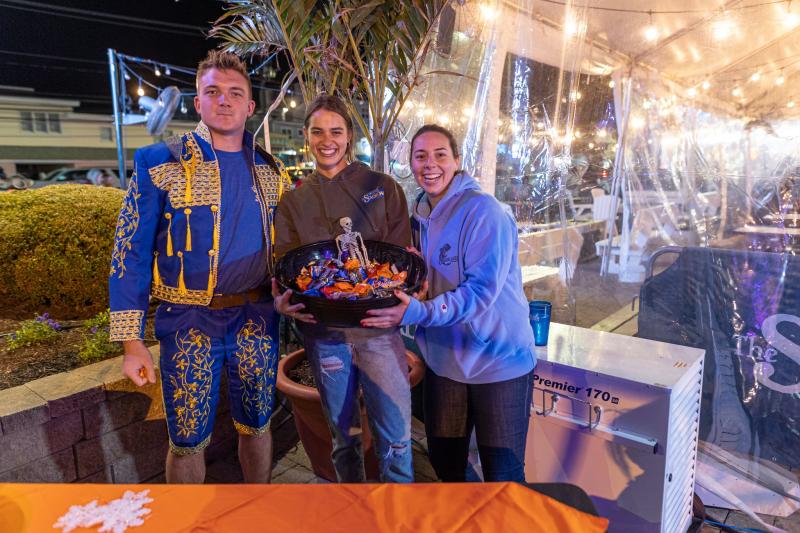 The Starboard employees (l-r) Tanner Tipton, Taylor Modica and Olivia Michael have a basket of treats at the ready.