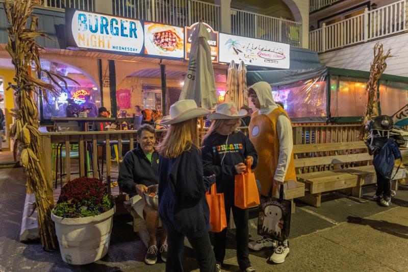Woody’s Dewey Beach owner and Dewey Business Partnership Vice President Jimmy O’Conor, seated, was passing out candy all night long.