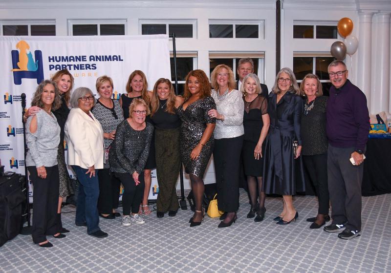 A group of residents and animal lovers from Peninsula Lakes in Long Neck attend the event. Shown are (l-r) Lucie Groeger, Debi Strauch, Vera Badmaer, Karen Verdugo, Debbie Reilly, Lisa Taylor-Moynihan, Marie Gillespie, April Armstrong, Melissa Payea, Gary Payea, Linda Bell, Jan Reddington, Gale Stawicki and Joe Reilly.