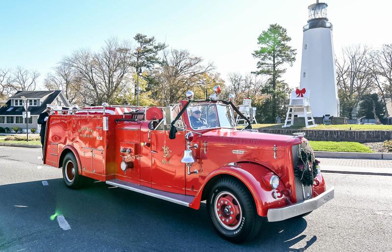 The Rehoboth Beach Volunteer Fire Company’s antique 1954 Ward LaFrance carries Danny Mitchell’s casket to its final resting place at Epworth Methodist Cemetery on Henlopen Avenue.