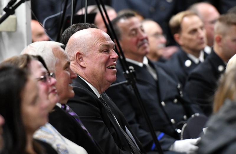 Speaker of the House of Rep. Pete Schwartzkopf, D-Rehoboth Beach, reacts to a funny story told by Danny Mitchell’s brother Richard “Dickie” Mitchell Jr.