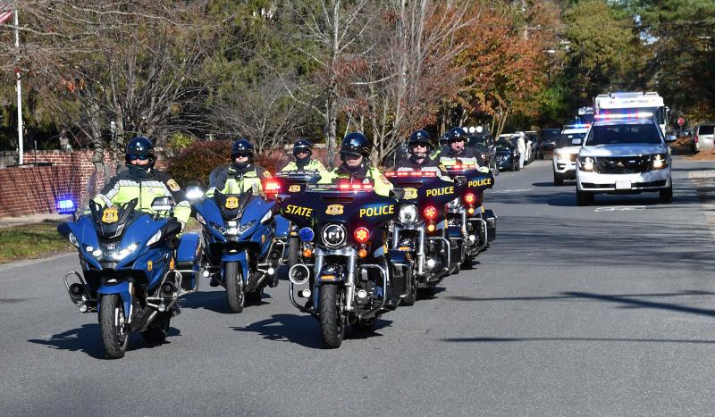 The Delaware State Police motorcycle squad leads the procession to Epworth Methodist Cemetery on Henlopen Avenue.