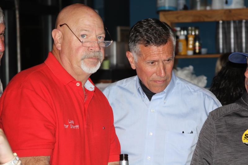 Steve Smyk, right, checks out the returns Nov. 8 after the polls closed along with Sussex County Sheriff Robert Lee.