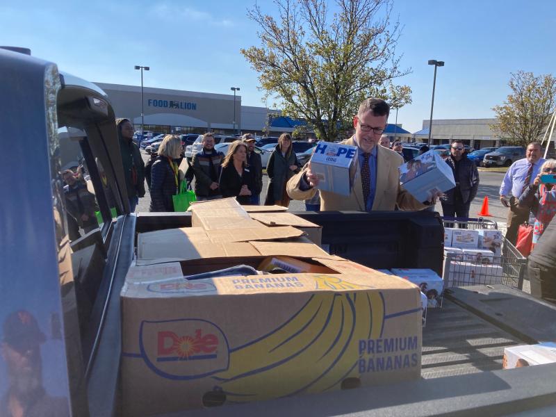 Alan Phillips, director of operations for Food Lion, loads boxes of food at the kickoff event of 302 Food Rescue in Milford Nov. 17. A collaboration among the Food Bank of Delaware, Bayhealth and Food Lion, 302 Food Rescue helps connect volunteers with food pantries to help deliver fresh foods rescued from grocery stores and restaurants. RYAN MAVITY PHOTOS