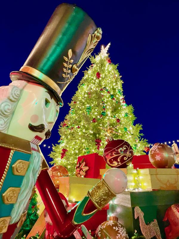 A larger-than-life nutcracker is among the impressive decorations included among the centerpiece Christmas tree holiday decor.