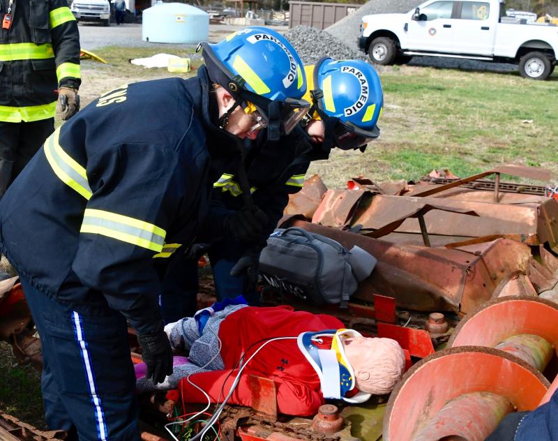 Sussex paramedics Brittany McCloskey, left, and Kristin Endres assess a “patient” who is injured in a farm accident.