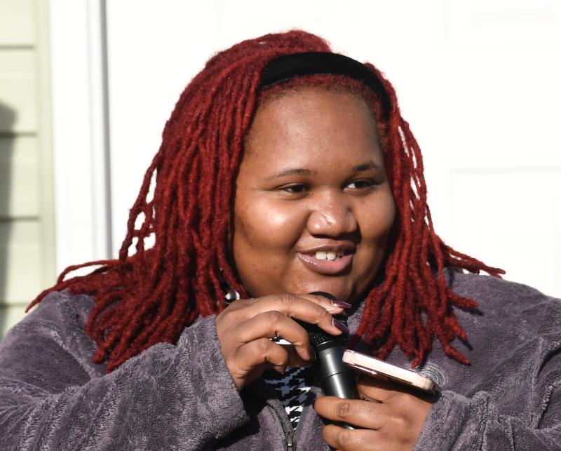 Kenya Neal, Habitat’s homeowners support manager, introduces some of the families who will move into the new homes.