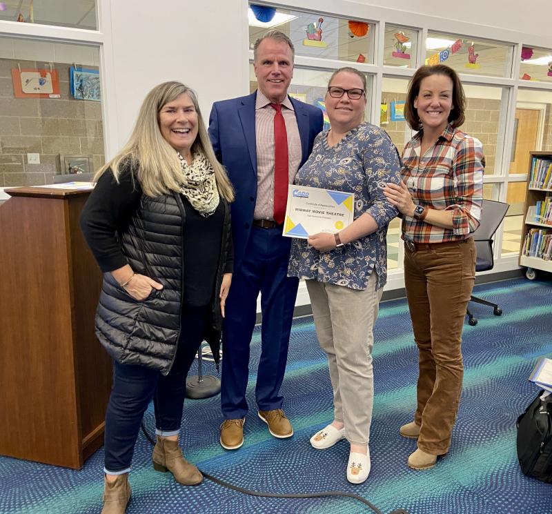 Movies at Midway was recognized by the Cape Henlopen school board Nov. 17 for its 20-year partnership in the Sussex Consortium vocational program. Gathered are (l-r) Sussex Consortium Job Coach DeeDee Meade, Cape Superintendent Bob Fulton, Movies at Midway representative Brooke Lowe, and school board President Alison Myers. ELLEN DRISCOLL PHOTO