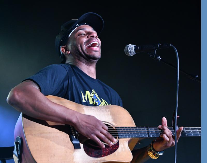 Jimmie Allen jokes with the audience of young students at Friday’s concert.