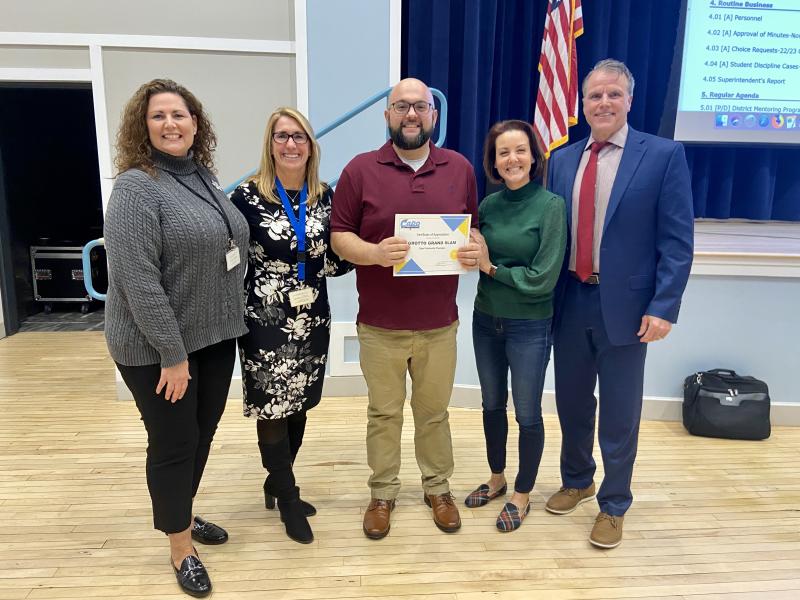 The Cape Henlopen school board recognized Grotto Pizza Grand Slam as a Community Champion at its Dec. 8 meeting. Gathered are (l-r) Sussex Consortium Vocational Coordinator Pam Graves, Sussex Consortium Principal Vivian Bush, Grotto Pizza Grand Slam General Manager Dave D'Ignoti, school board President Alison Myers and Cape Superintendent Bob Fulton. ELLEN DRISCOLL PHOTOS