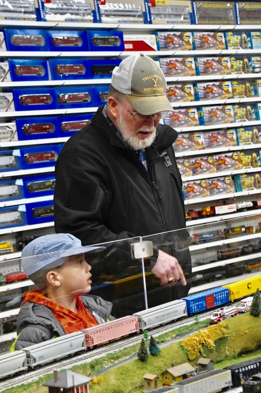 Train display organizer and society President Jim Bowden always has time to talk with little railroaders, including Paulie Kershaw, 6, of Milford during a Dec. 10 open house.