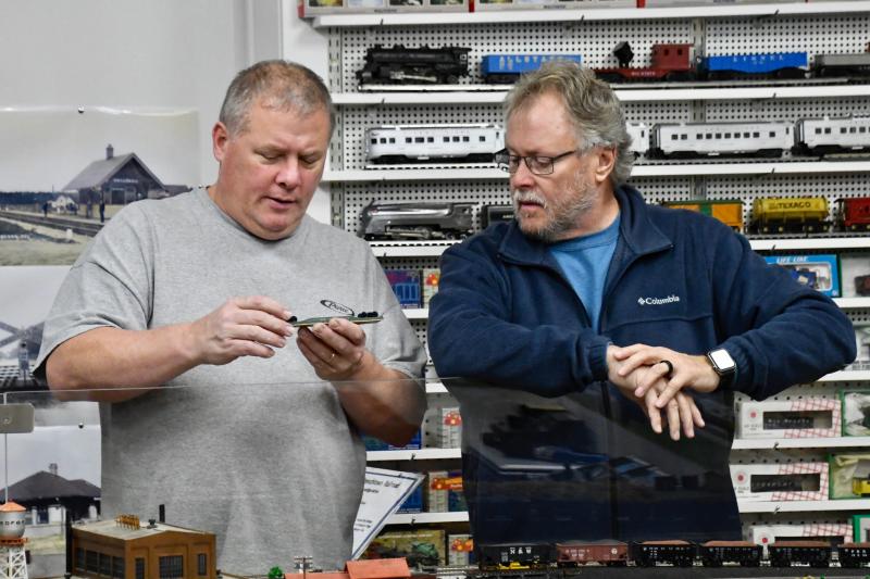 Volunteers Kevin Brown, left, and Ronnie Gillespie, both of Seaford, look over a piece to be added to the layout.