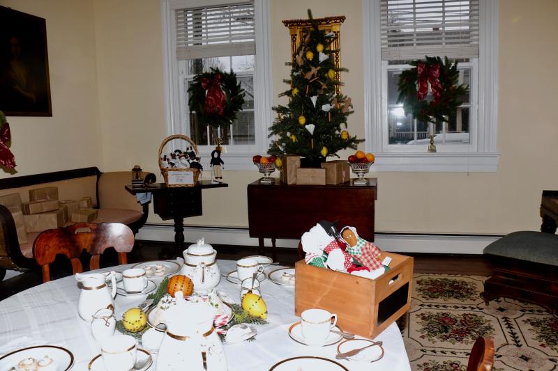 The living room inside the Burton-Ingram House shows what a Christmas morning during Colonial times might have looked like for children.