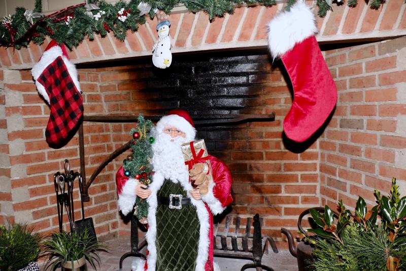 Santa would not comment on whether the soot came from using the fireplace or the coal in his sack marking the brick with each slide.